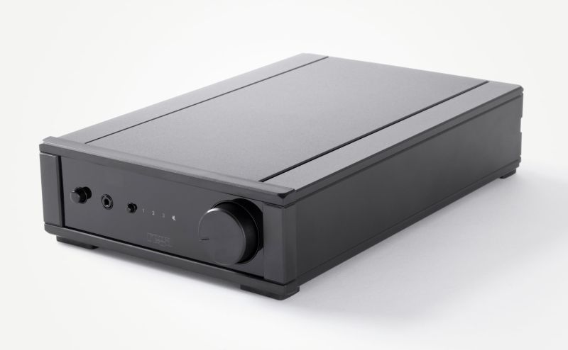 The black Rega io seen from the front left and slightly above, its volume knob, row of small buttons and input markings on the fascia