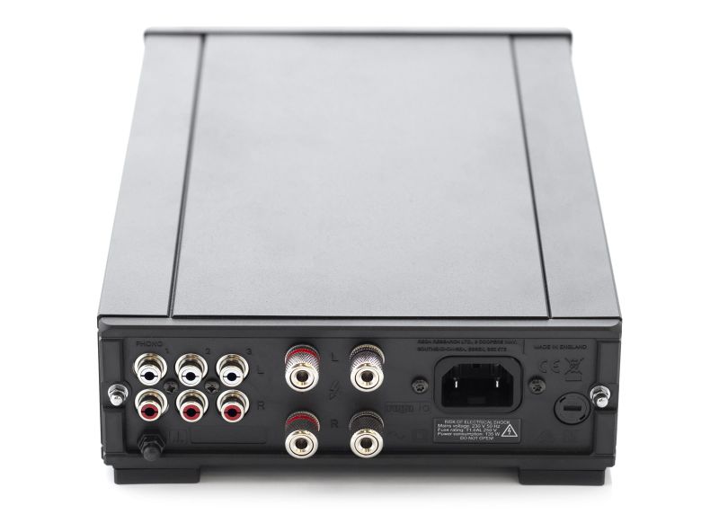 The io rear panel from above right: three pairs of RCA sockets, the loudspeaker terminals and the IEC mains inlet