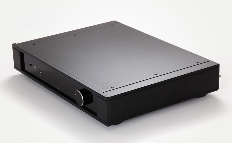The Elex MK4 in black from the front left and above, full width case, three small buttons, row of input markers and the volume knob