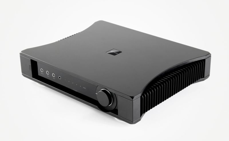 The Aethos from the front left and above, the curved top plate sweeping down into the finned heatsink flanks either side of the fascia