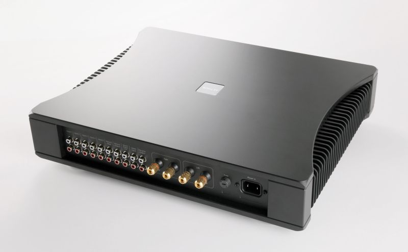 The whole Aethos seen from behind and to the left, the curved top, both heatsink flanks and the full rear socket panel in one view