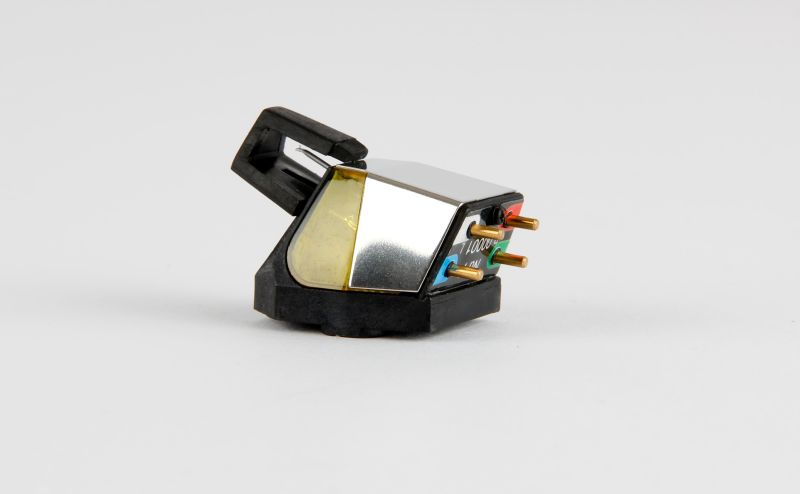 The Nd7 three-quarter with the black stylus guard clipped over the front, gold pins at the rear