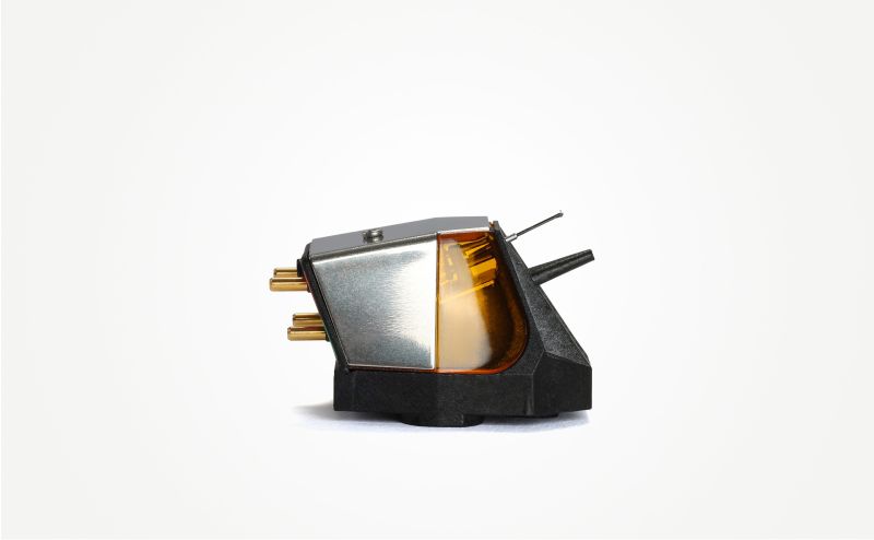 The Nd9 in studio side view, amber window panel beside the mirror-polished flank on the black moulded body