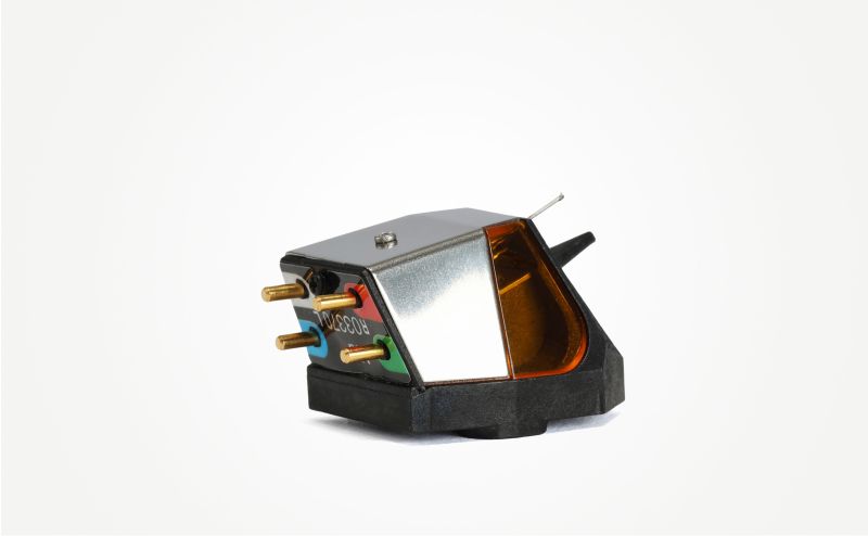 The Nd9 from the rear three-quarter, four gold output pins with colour-coded tag wires and the printed body label