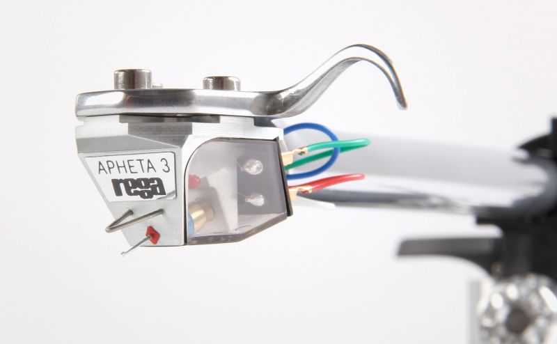 The Apheta 3 mounted on a polished aluminium headshell and arm, coloured tag wires curving back to the arm tube