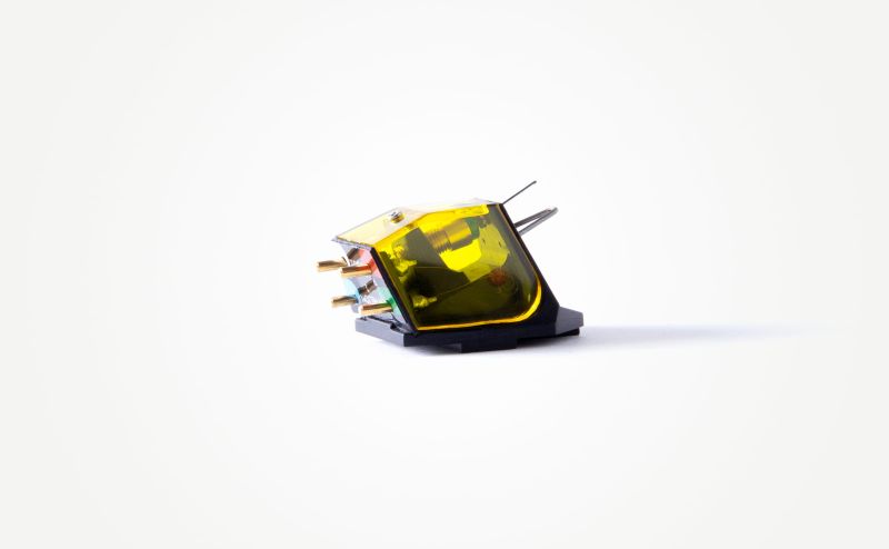 The Aphelion 2 from the rear three-quarter, the yellow body showing the internal coil assembly and four gold output pins