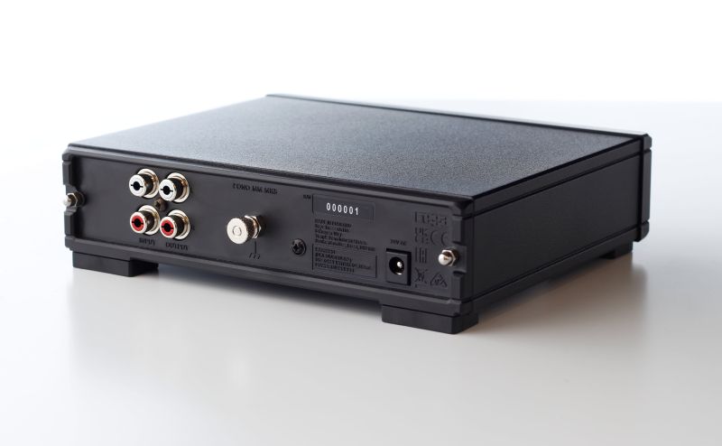 The rear of the Fono MM MK5 at an angle, with the input and output phono sockets, the earth post and the 24 V power inlet