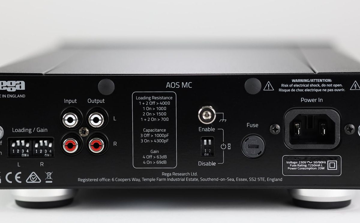 The Aos MC rear panel, its Loading and Gain DIP switches printed with the resistance, capacitance and gain table, beside the input and output sockets and the standby Enable switch