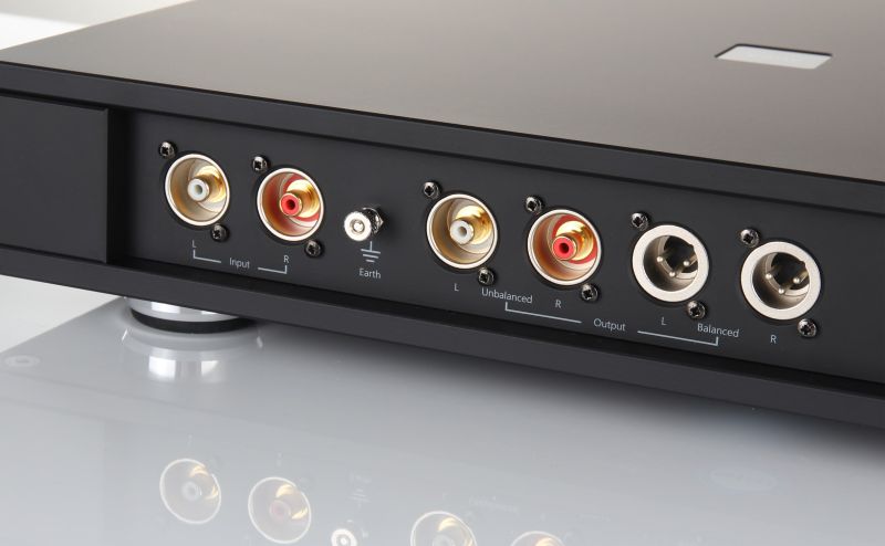 The Aura MC rear panel at an angle, with the phono input, the earth post, the unbalanced phono outputs and the balanced XLR outputs