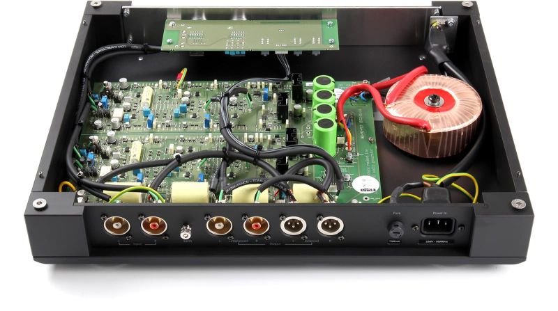 The Aura MC seen from above with the lid off, showing the full circuit board, the toroidal transformer and the rear socket bank