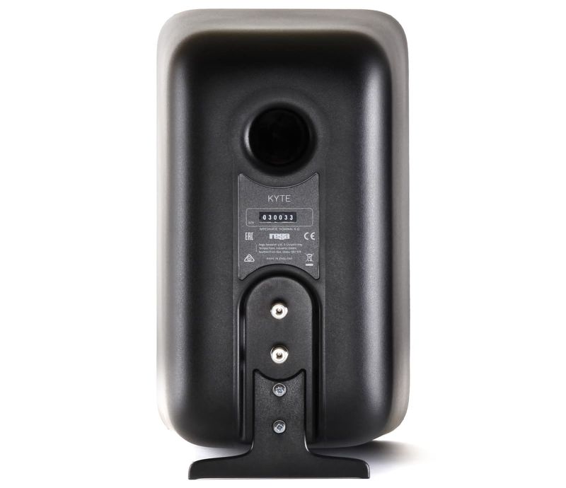 Rear of a black Kyte, showing the flared bass reflex port, the KYTE serial plate and the bolted-on rear foot