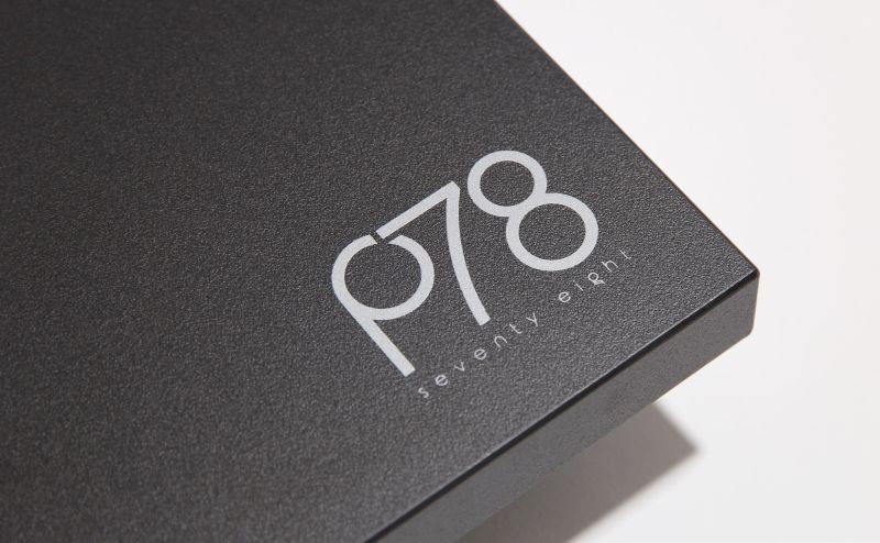 The matt black plinth edge carrying the p78 seventy eight badge