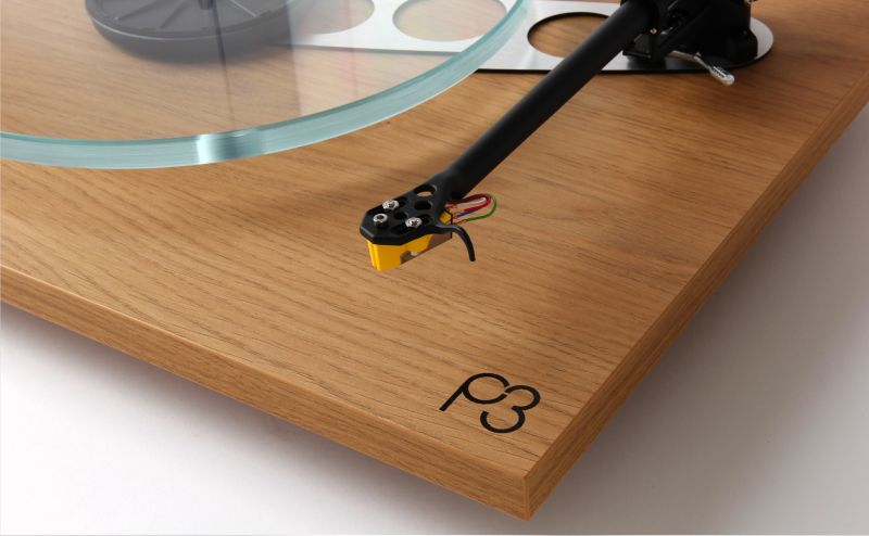 The RB330 headshell and cartridge above the Light oak effect plinth and the P3 badge