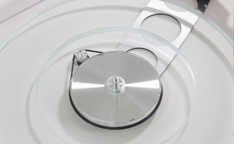 The dual layer float glass platter lifted clear, showing the machined aluminium sub-platter