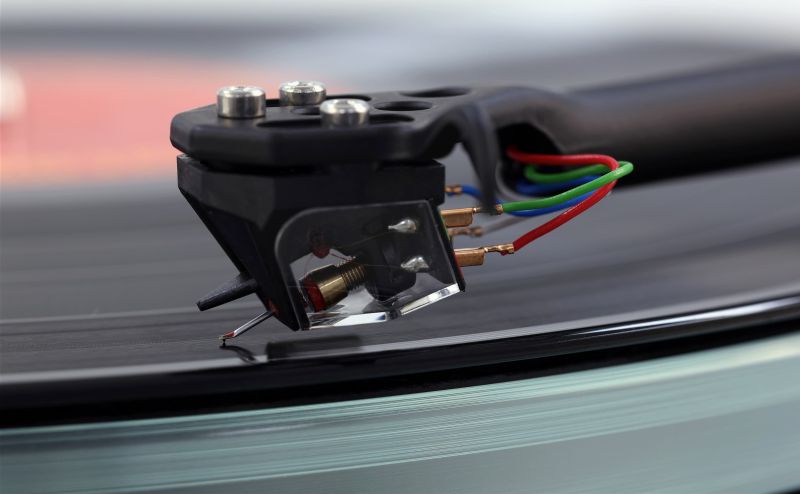 Macro of the Ania moving coil cartridge and its tag wires above the glass platter